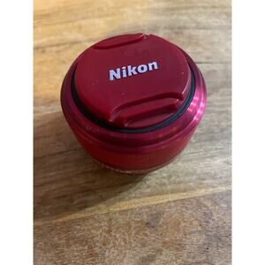 Used: Nikon 1 nikkor 11-27.5mm f/3.5-5.6 lens (Red) + front/back caps
